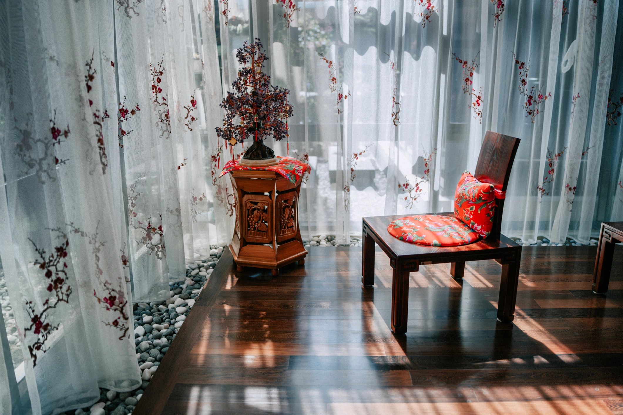 A sunlit chair by a window in a calm, quiet room